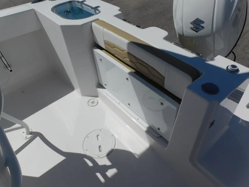 Slide: The Image of 2024 Aquasport 2200 Center Console boat interior with seating and storage. - 29