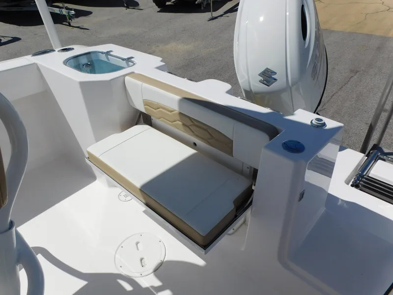 Slide: The Image of 2024 Aquasport 2200 Center Console boat with seating and Suzuki outboard motor. - 30