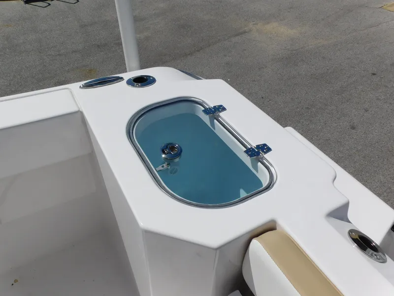 Slide: The Image of 2024 Aquasport 2200 Center Console livewell and seating area. - 31
