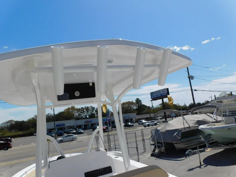 Slide: The Image of 2024 Aquasport 2200 Center Console boat on display at a dealership. - 37