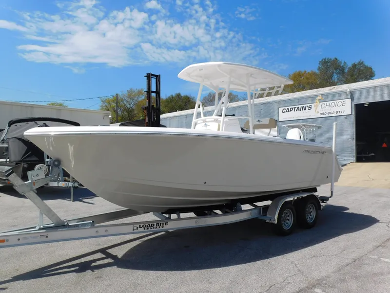 Slide: The Image of 2024 Aquasport 2200 Center Console boat on a trailer at a dealership. - 4