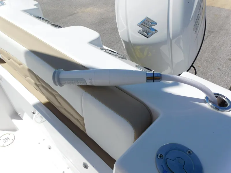Slide: The Image of 2024 Aquasport 2200 Center Console boat with Suzuki outboard motor. - 40