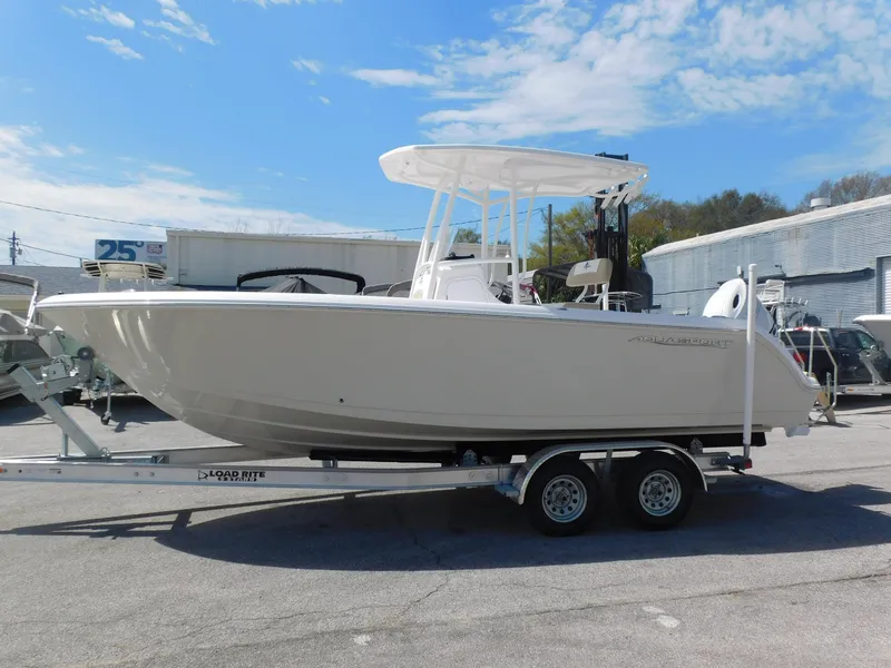 Slide: The Image of 2024 Aquasport 2200 Center Console boat on a trailer, side view. - 5