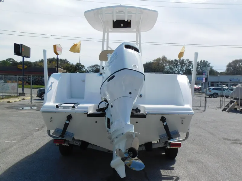 Slide: The Image of 2024 Aquasport 2200 Center Console boat, rear view with outboard motor. - 6