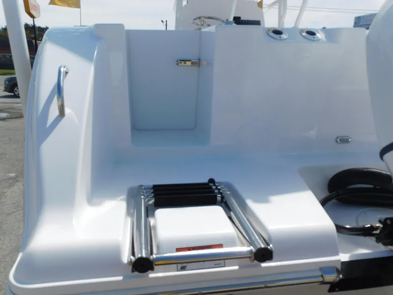 Slide: The Image of 2024 Aquasport 2200 Center Console boat stern with ladder and storage compartment. - 7