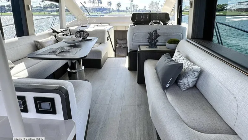 Slide: The Image of Luxurious interior of 2024 Galeon 560 Fly yacht with modern seating and dining area. - 12