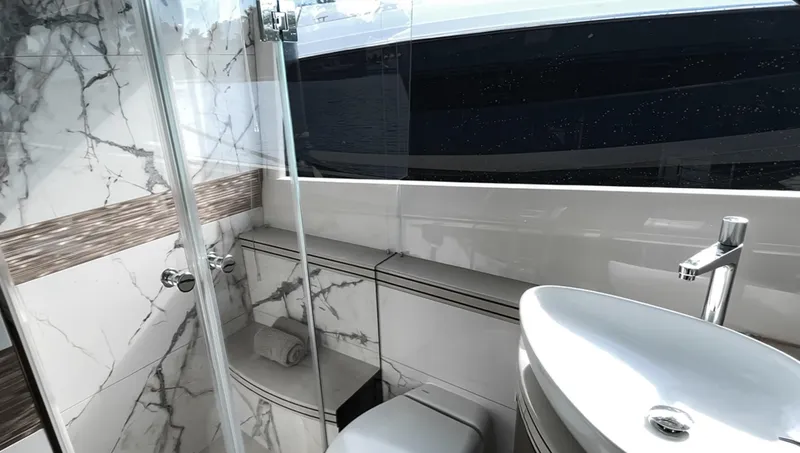 Slide: The Image of Luxurious bathroom in 2024 Galeon 560 Fly yacht with marble accents and modern fixtures. - 20