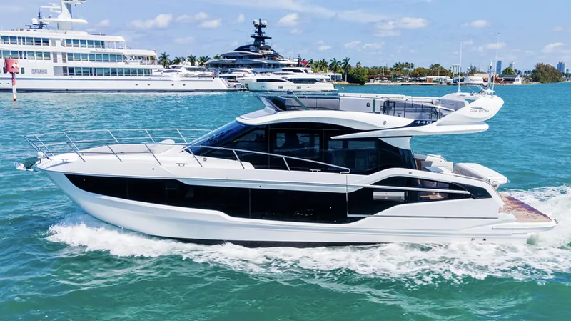 The Image of 2025 Galeon 440 Fly yacht cruising on clear blue water. - 0