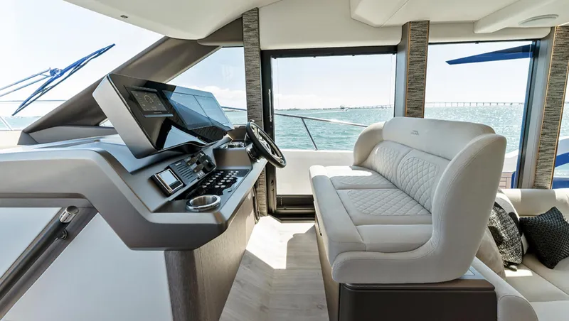 Slide: The Image of Modern helm station of 2025 Galeon 440 Fly yacht with luxurious seating and advanced navigation systems. - 12