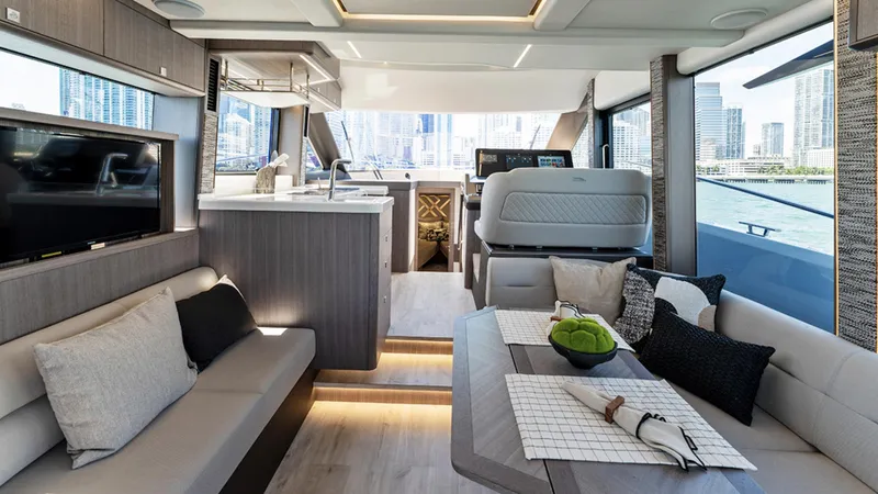 Slide: The Image of Luxurious interior of the 2025 Galeon 440 Fly yacht with modern furnishings and cityscape view. - 13