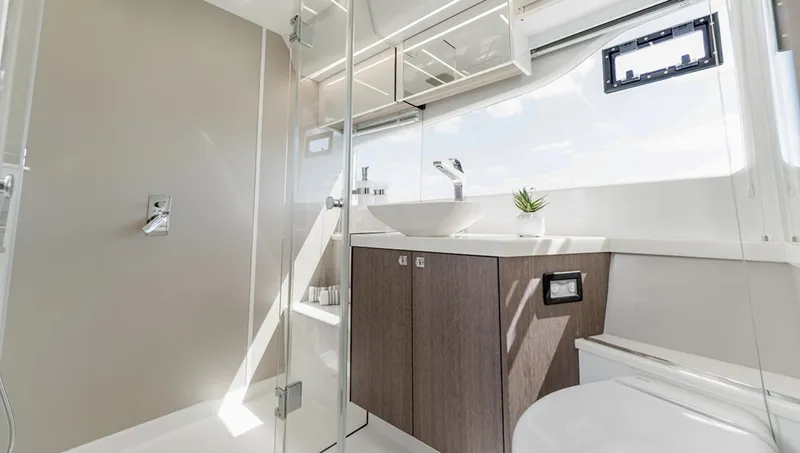 Slide: The Image of Modern bathroom interior of Galeon 440 Fly 2025 yacht with sleek fixtures and ample natural light. - 16
