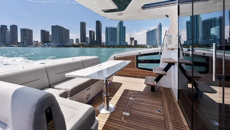 Slide: The Image of Galeon 440 Fly 2025 yacht with city skyline in the background. - 5