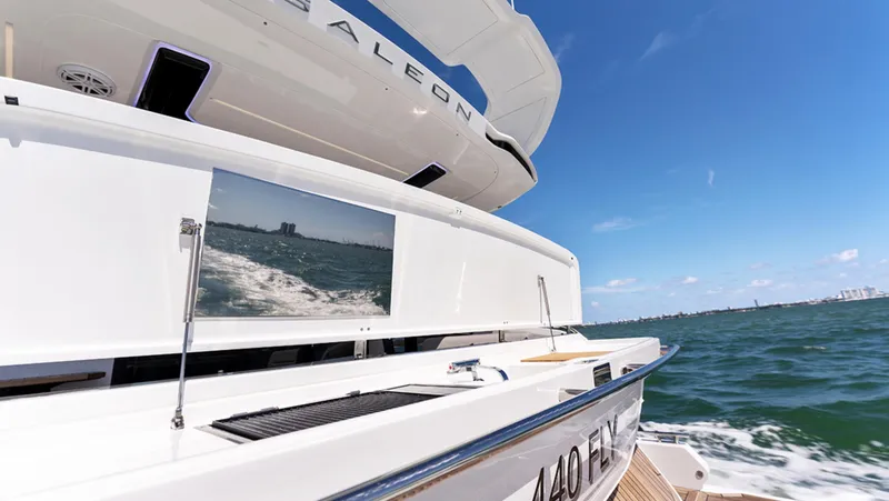 Slide: The Image of Galeon 440 Fly 2025 yacht cruising on open water, rear view. - 8