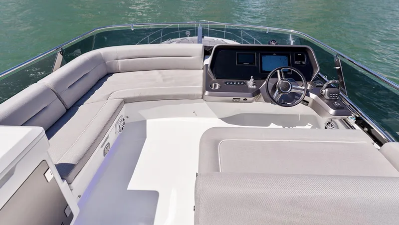 Slide: The Image of Flybridge of 2025 Galeon 440 Fly yacht with modern helm and spacious seating. - 9