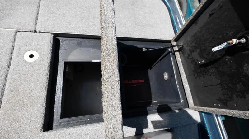 Slide: The Image of Open storage compartments on a 2001 Skeeter ZX200 boat. - 13