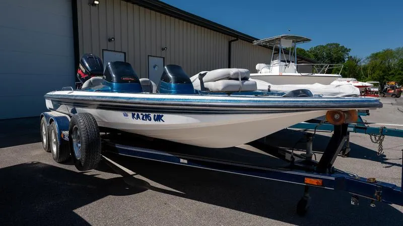 Slide: The Image of 2001 Skeeter ZX200 boat on a trailer outside a building. - 14