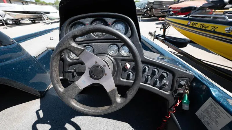 Slide: The Image of 2001 Skeeter ZX200 boat dashboard and steering wheel. - 2