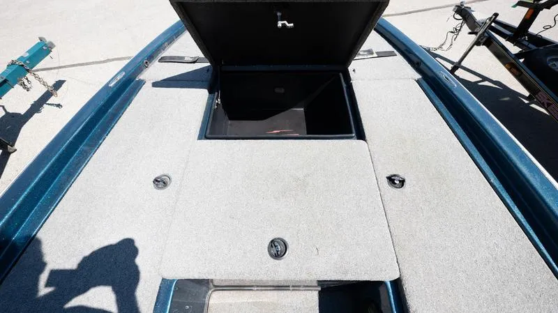 Slide: The Image of 2001 Skeeter ZX200 boat deck with open storage compartment. - 3