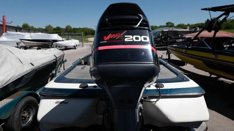 Slide: The Image of 2001 Skeeter ZX200 boat with VMAX 200 engine in a marina. - 5