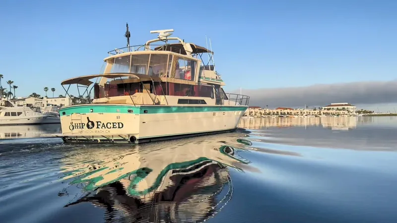 Slide: The Image of 1987 Hi-Star Yacht Fisher 55 cruising in a calm marina. - 2