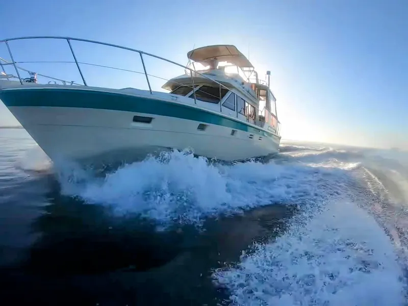 Slide: The Image of 1987 Hi-Star Yacht Fisher 55 cruising on open water. - 3