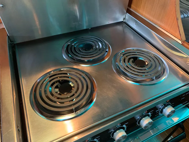 Slide: The Image of Stainless steel electric stove on 1987 Hi-Star Yacht Fisher 55. - 33
