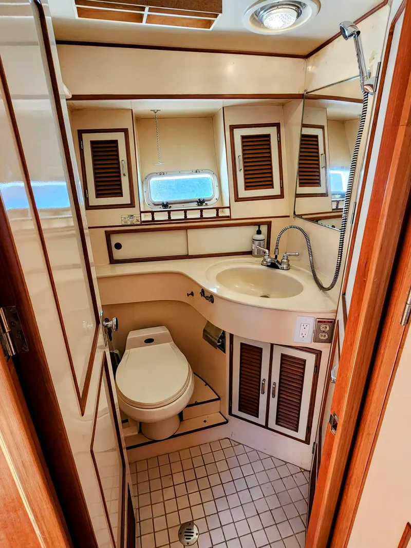 Slide: The Image of 1987 Hi-Star Yacht Fisher 55 bathroom with sink, toilet, and shower. - 34