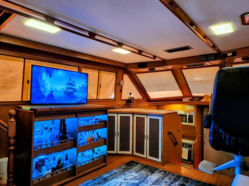 Slide: The Image of Interior of 1987 Hi-Star Yacht Fisher 55 with TV and illuminated bar. - 36