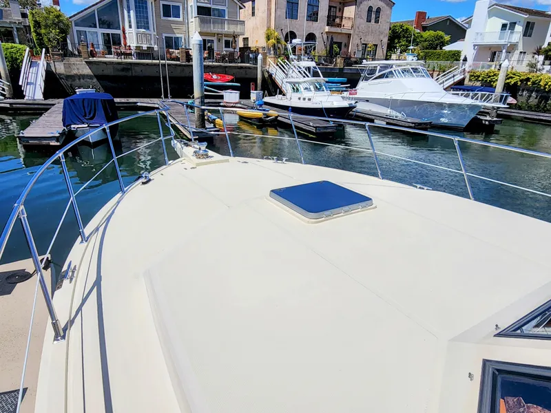 Slide: The Image of 1987 Hi-Star Yacht Fisher 55 docked in a marina with other boats. - 44