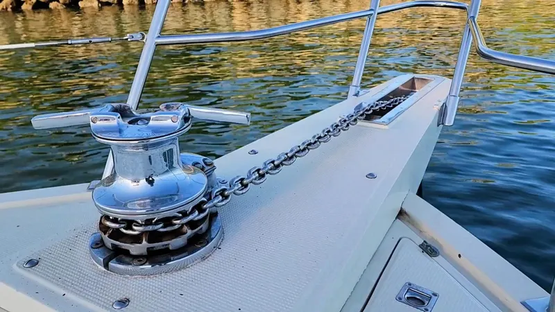 Slide: The Image of Anchor winch on 1987 Hi-Star Yacht Fisher 55, docked on calm waters. - 45