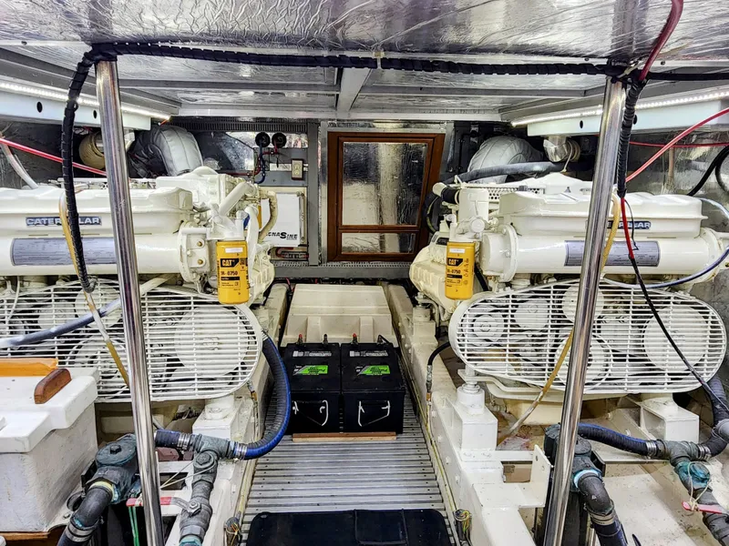 Slide: The Image of Engine room of a 1987 Hi-Star Yacht Fisher 55 with twin Caterpillar engines. - 46