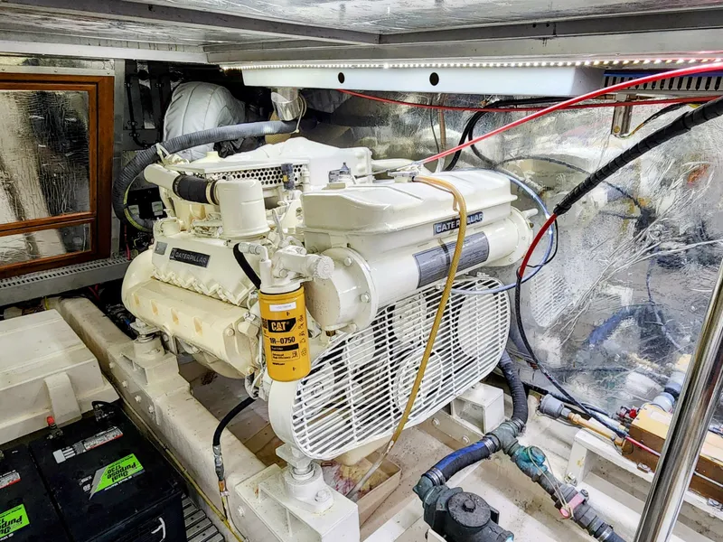 Slide: The Image of Engine room of a 1987 Hi-Star Yacht Fisher 55 with a Caterpillar engine. - 48