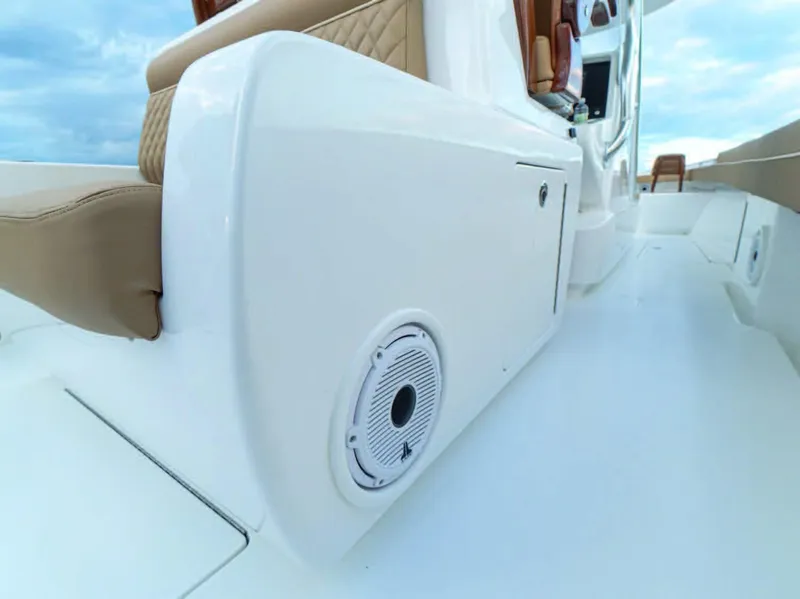Slide: The Image of 2025 Valhalla Boatworks V-37 interior, featuring white paneling and beige seating. - 11