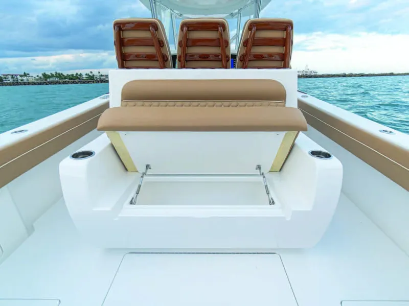 Slide: The Image of 2025 Valhalla Boatworks V-37 with tan seating and storage compartment. - 14