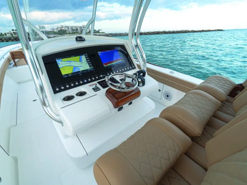 Slide: The Image of 2025 Valhalla Boatworks V-37 helm with dual displays and luxurious seating. - 17