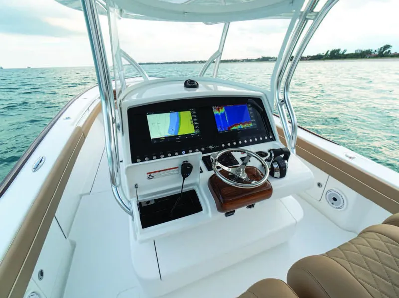 Slide: The Image of 2025 Valhalla Boatworks V-37 helm with dual navigation screens on the water. - 19
