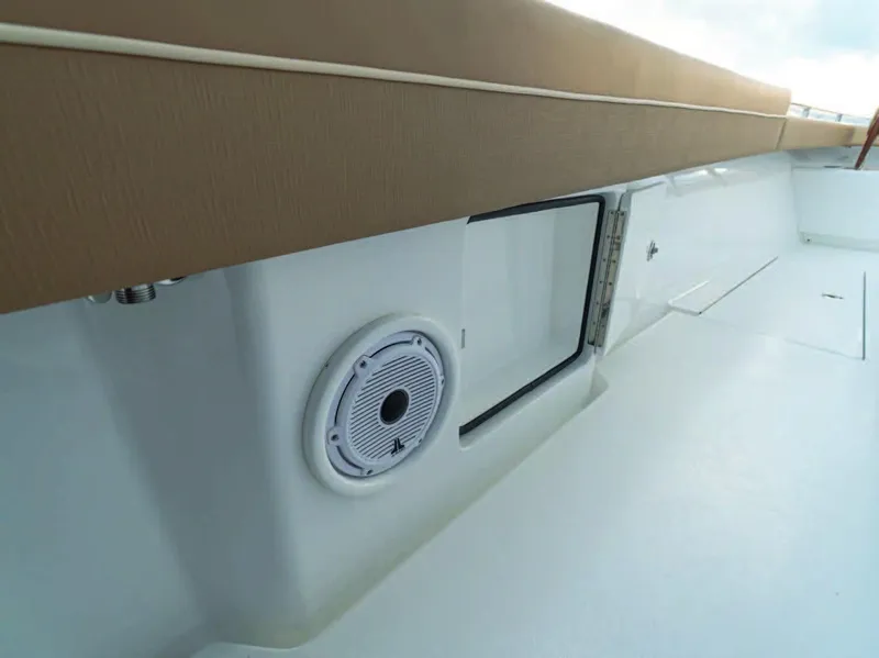 Slide: The Image of 2025 Valhalla Boatworks V-37 interior, featuring a speaker and storage compartment. - 21
