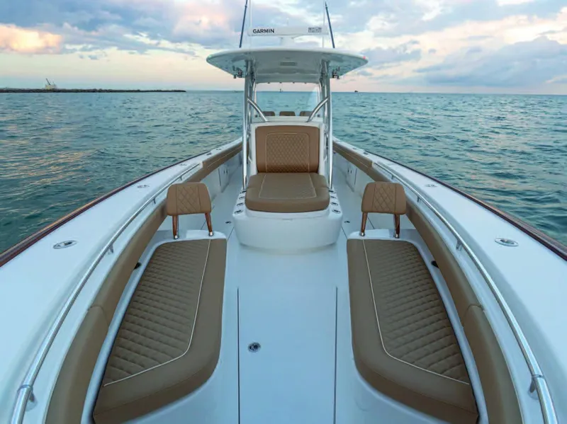 Slide: The Image of 2025 Valhalla Boatworks V-37 center console boat with tan seating on the open water. - 34