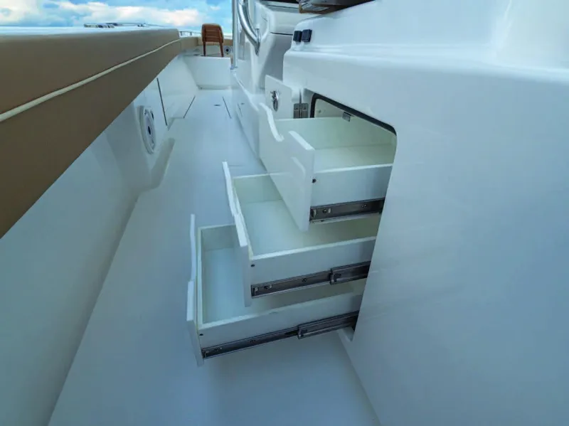 Slide: The Image of Valhalla Boatworks V-37 2025 model with open storage drawers on deck. - 9