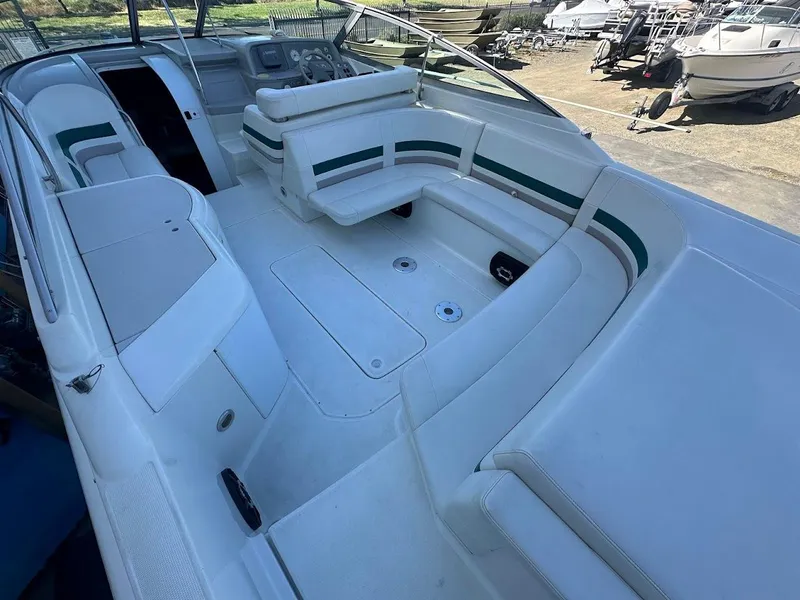 Slide: The Image of 1999 Formula 330 SS boat interior with white and green seating. - 13