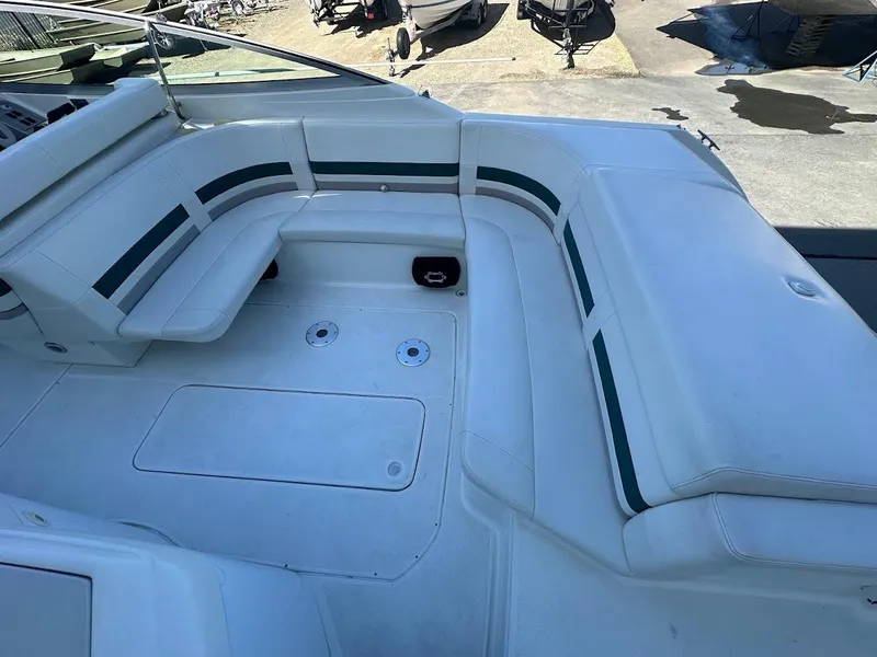 Slide: The Image of 1999 Formula 330 SS boat interior with white and green seating. - 14