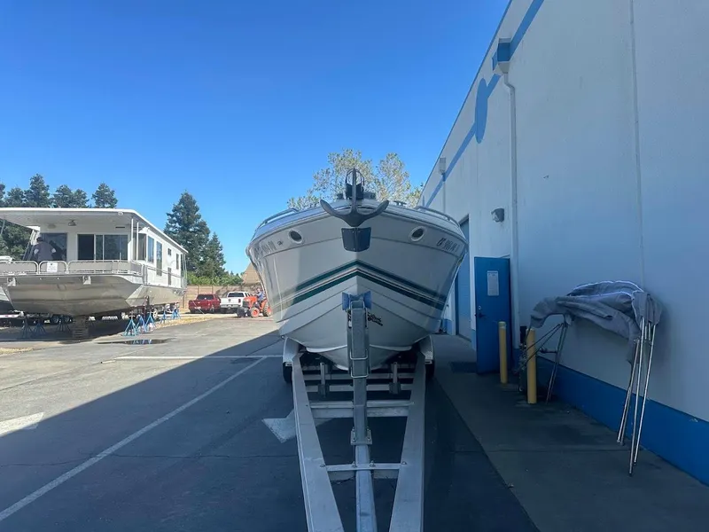 Slide: The Image of 1999 Formula 330 SS boat on trailer in marina storage area. - 2