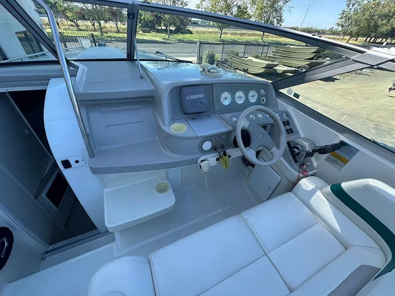 Slide: The Image of 1999 Formula 330 SS boat cockpit with steering wheel and dashboard. - 24