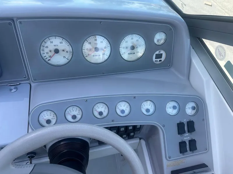 Slide: The Image of 1999 Formula 330 SS boat dashboard with gauges and controls. - 25