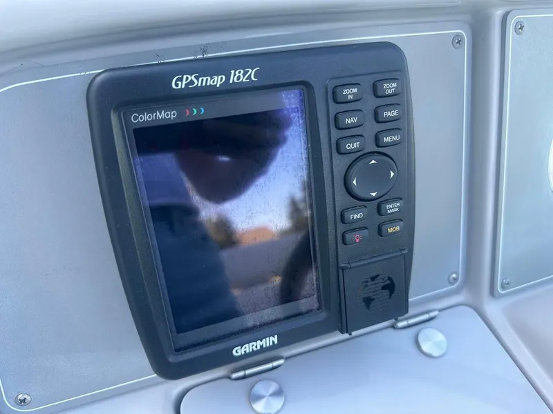 Slide: The Image of Garmin GPSmap 182C on 1999 Formula 330 SS boat dashboard. - 26