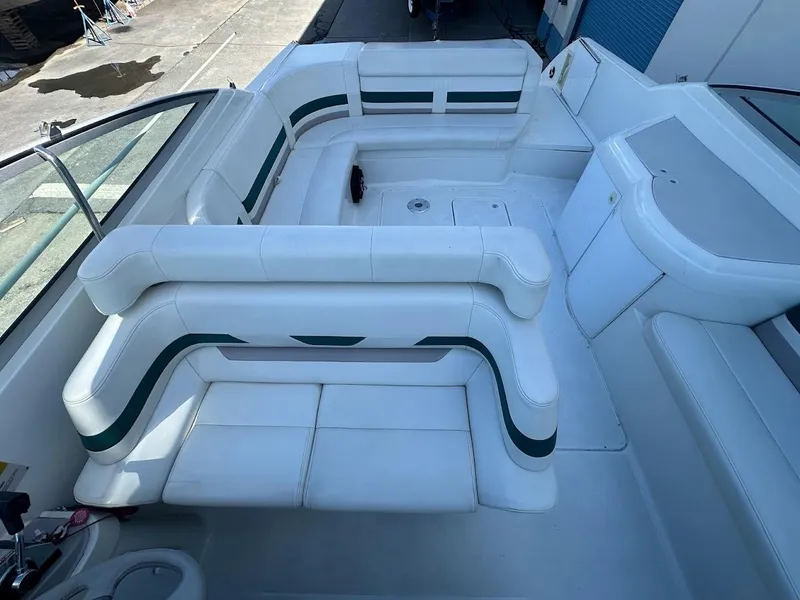 Slide: The Image of 1999 Formula 330 SS boat interior with white and green seating. - 28