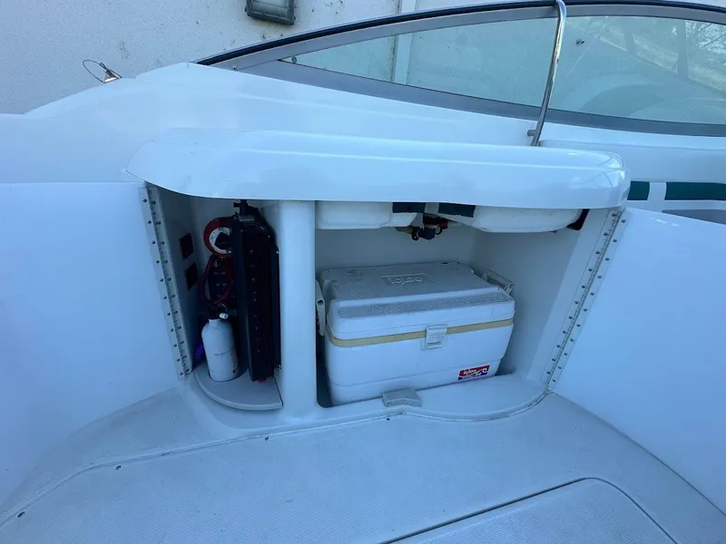 Slide: The Image of 1999 Formula 330 SS boat storage compartment with cooler and equipment. - 30