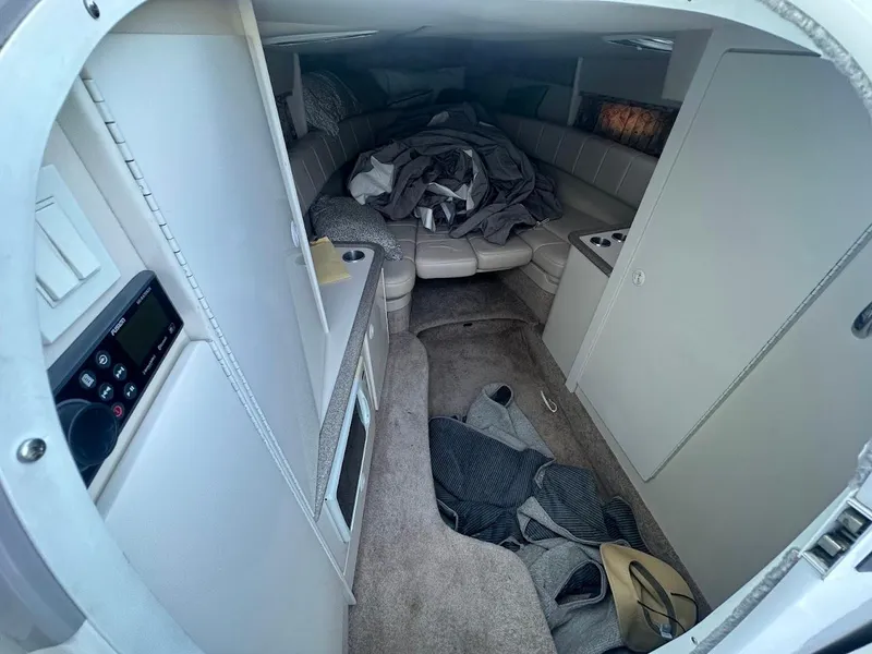 Slide: The Image of Interior cabin of a 1999 Formula 330 SS boat with seating and storage. - 33