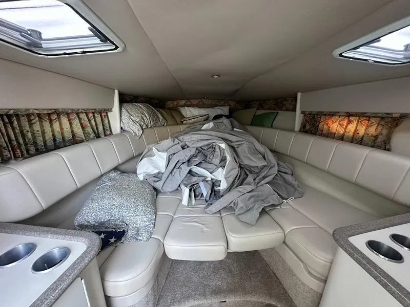 Slide: The Image of Interior cabin of a 1999 Formula 330 SS boat with seating and bedding. - 40