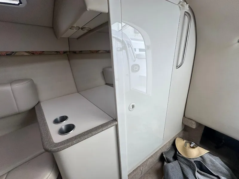 Slide: The Image of Interior cabin of a 1999 Formula 330 SS boat with seating and storage. - 41